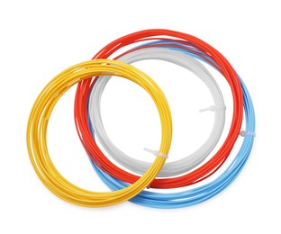 Colorful plastic filaments for 3D pen on white background, top view
