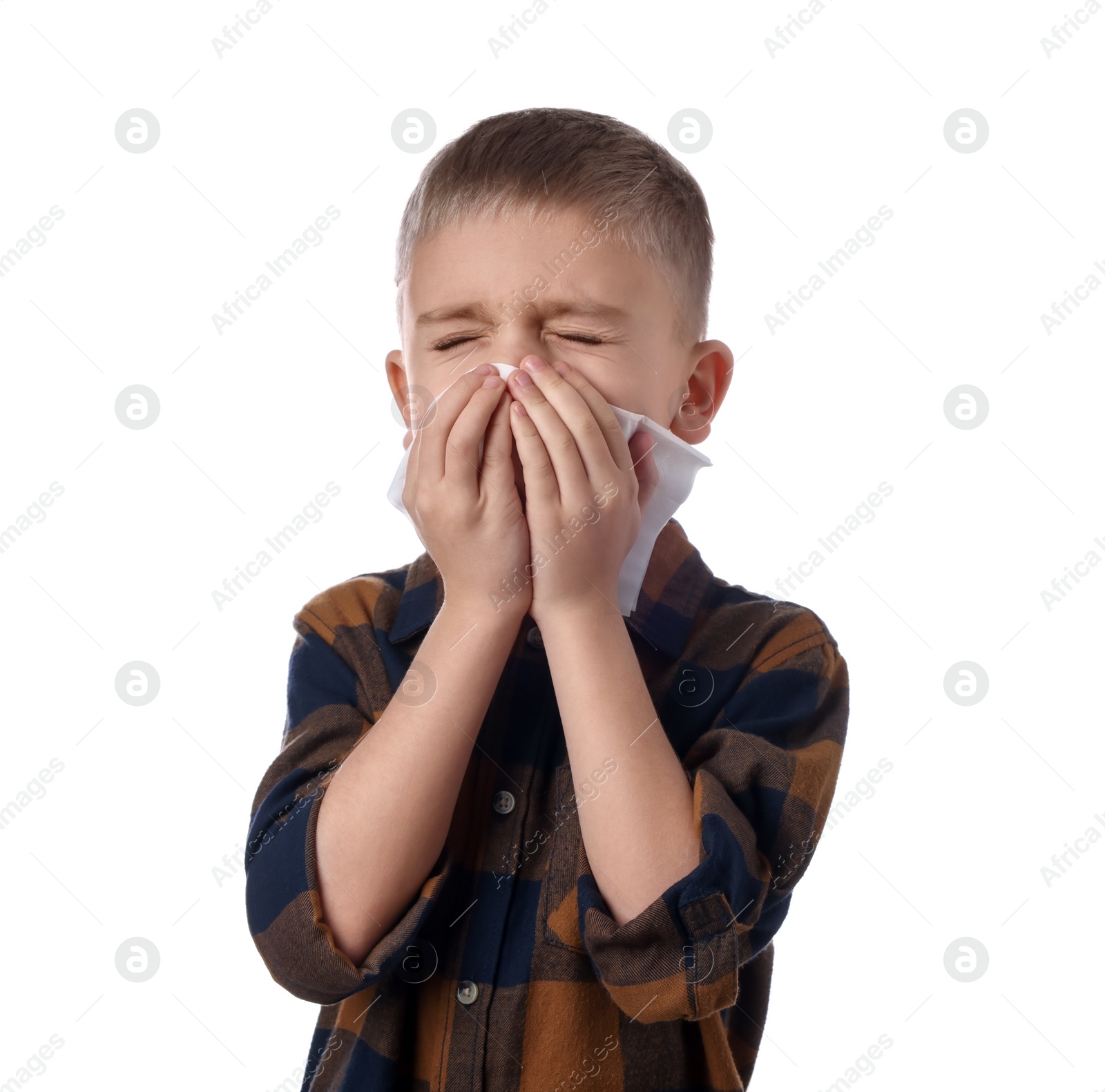 Photo of Sick boy with tissue coughing on white background. Cold symptoms