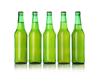 Photo of Green bottles with beer isolated on white