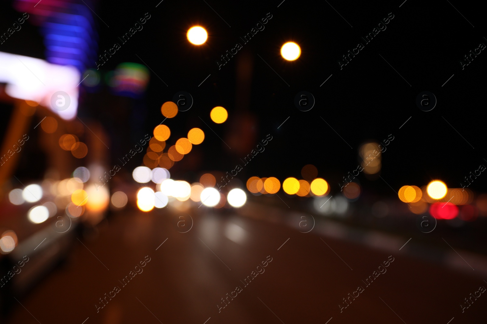 Photo of Blurred view of cityscape with bokeh effect. Night life