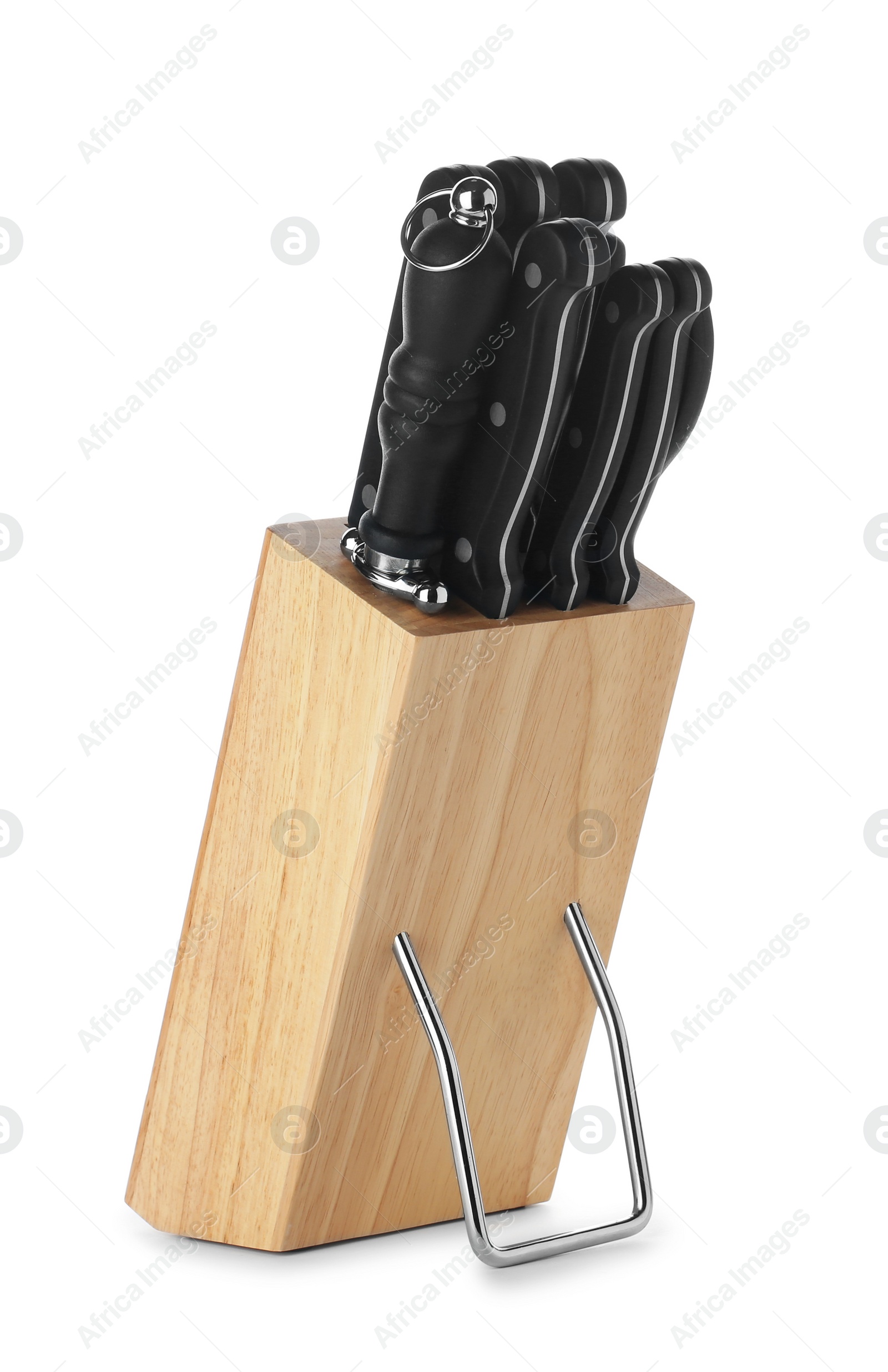 Photo of Wooden holder with different knives isolated on white