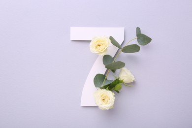 Photo of Paper number 7, beautiful flowers and eucalyptus branch on light grey background, top view