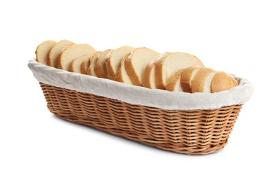 Slices of tasty fresh bread in wicker basket on white background