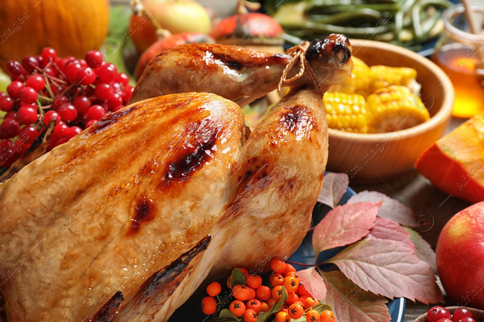 Photo of Composition with delicious turkey and autumn vegetables as background, closeup. Happy Thanksgiving day