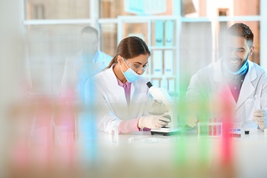 Photo of Young scientists working in laboratory. Chemical analysis