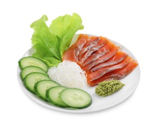 Photo of Sashimi set (salmon slices) with cucumber, greens, vasabi and funchosa isolated on white