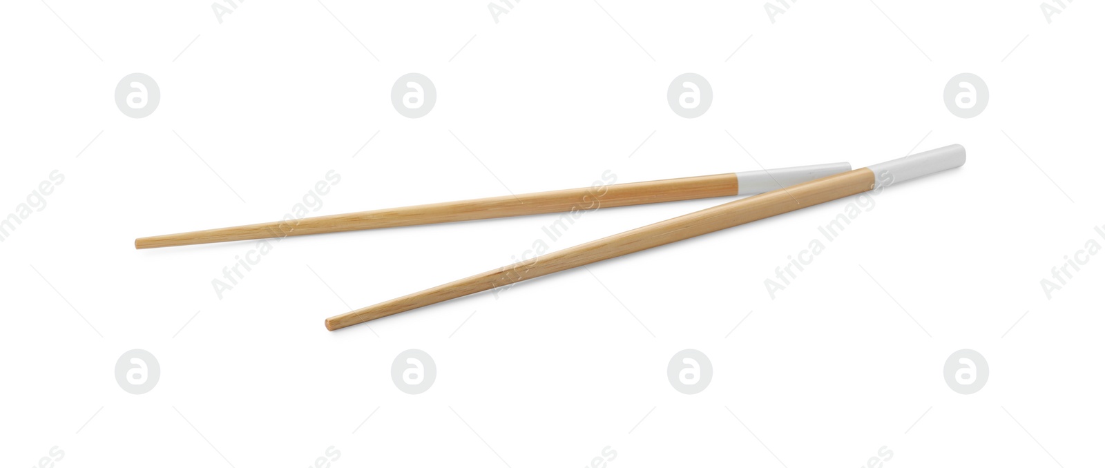 Photo of Pair of wooden chopsticks isolated on white