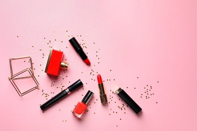 Photo of Flat lay composition with decorative cosmetics on color background