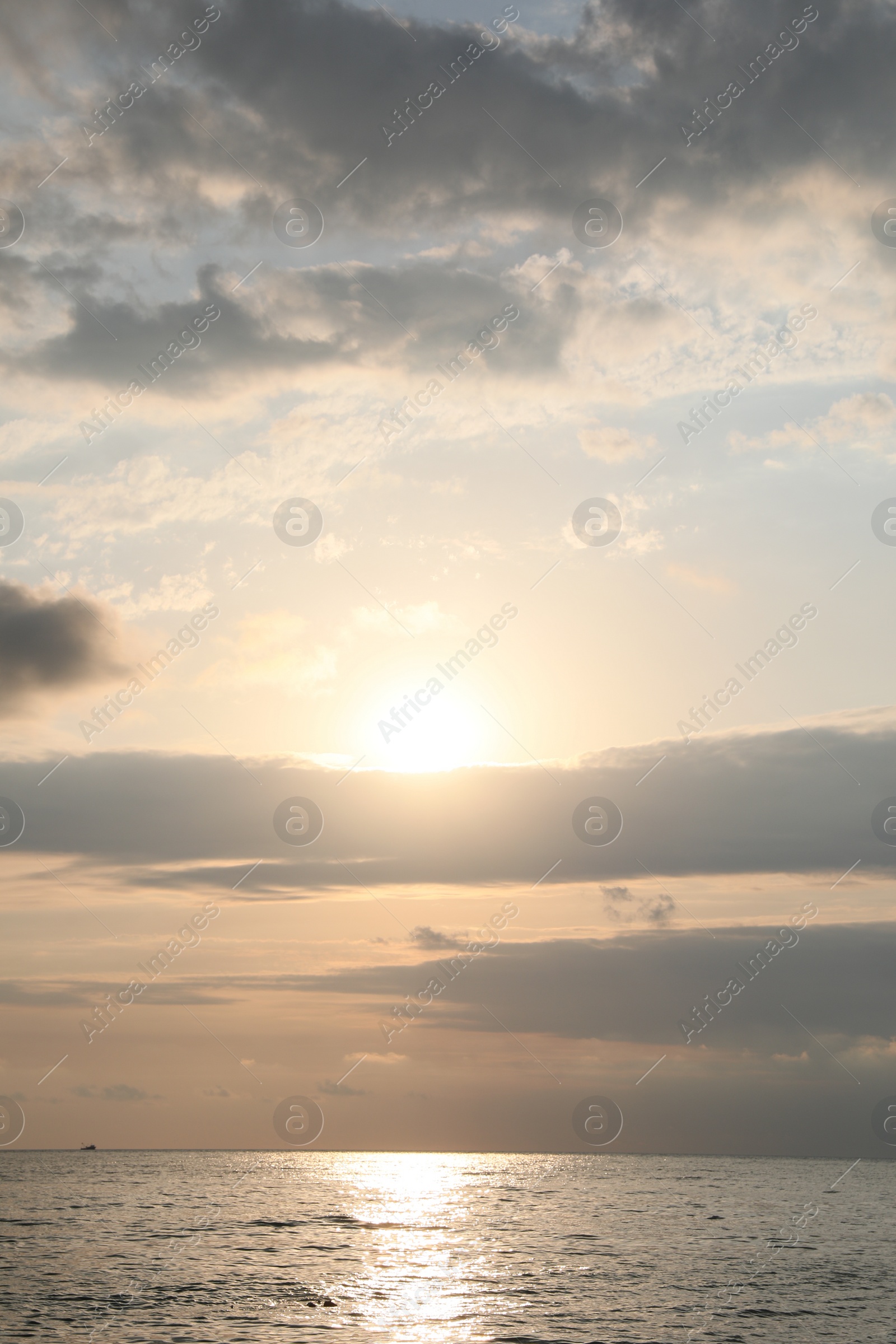 Photo of Picturesque view of sunset with beautiful clouds over sea