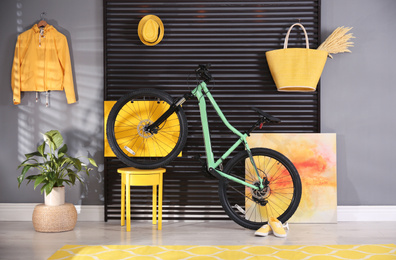 Photo of Modern bicycle in stylish living room interior