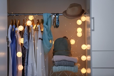 Photo of Women clothing on hangers in wardrobe