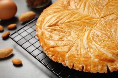 Traditional galette des rois on grey table, closeup