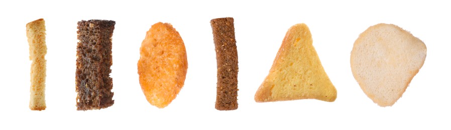 Set with different delicious crispy rusks on white background. Banner design