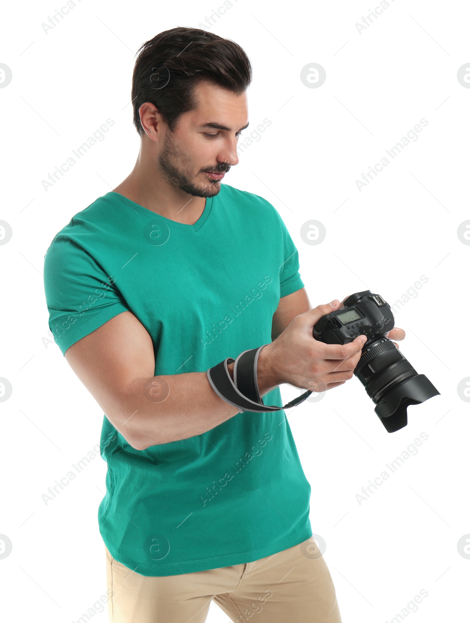 Photo of Young photographer with professional camera on white background