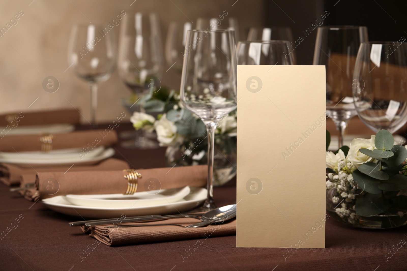 Photo of Stylish elegant table setting for festive dinner in restaurant