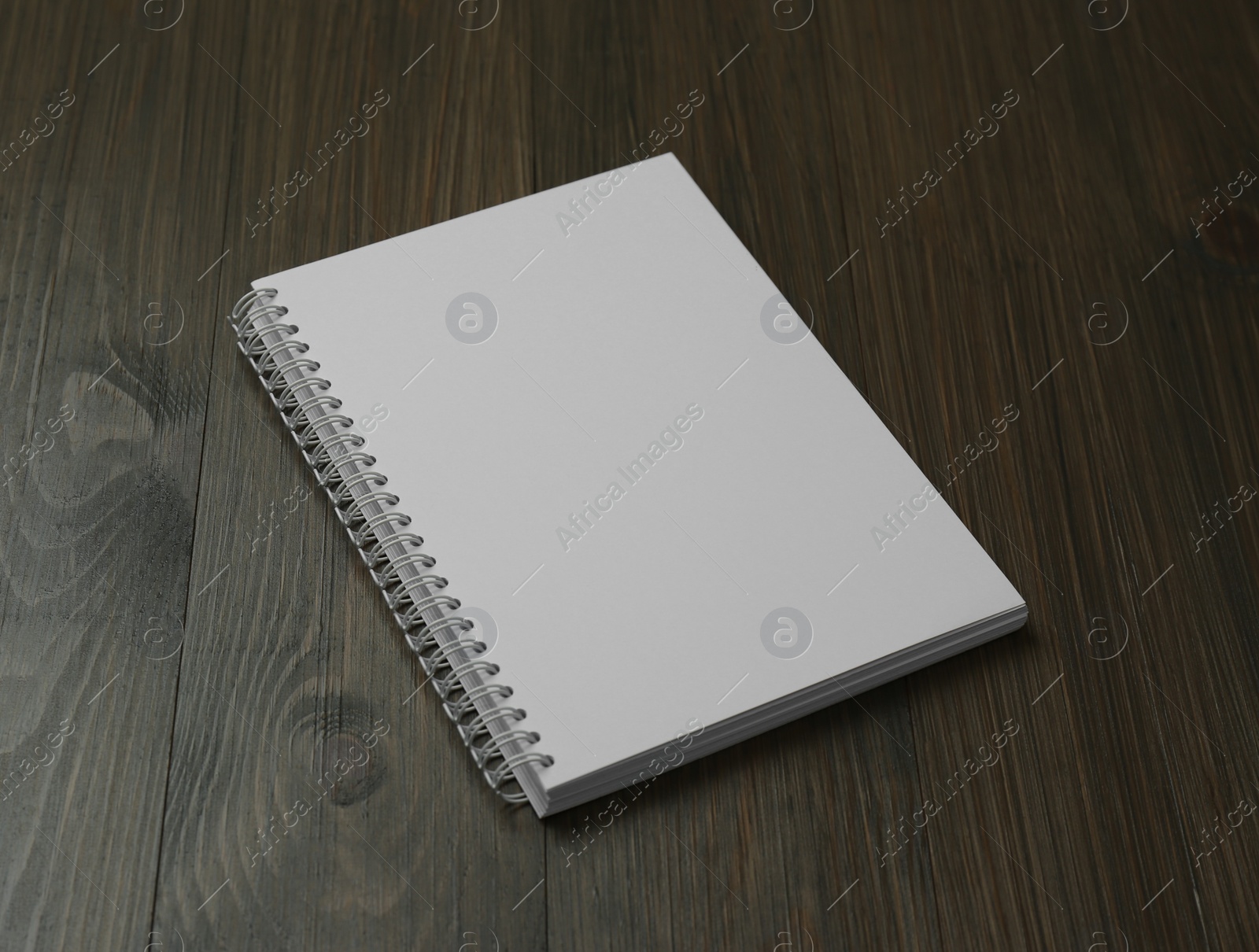 Photo of Blank paper brochure on wooden table. Mockup for design