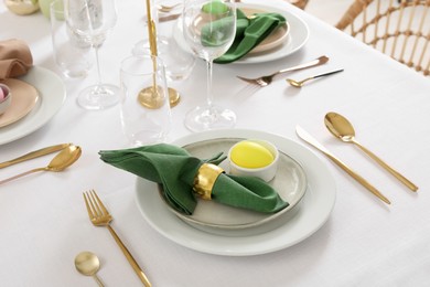 Photo of Festive Easter table setting with painted eggs