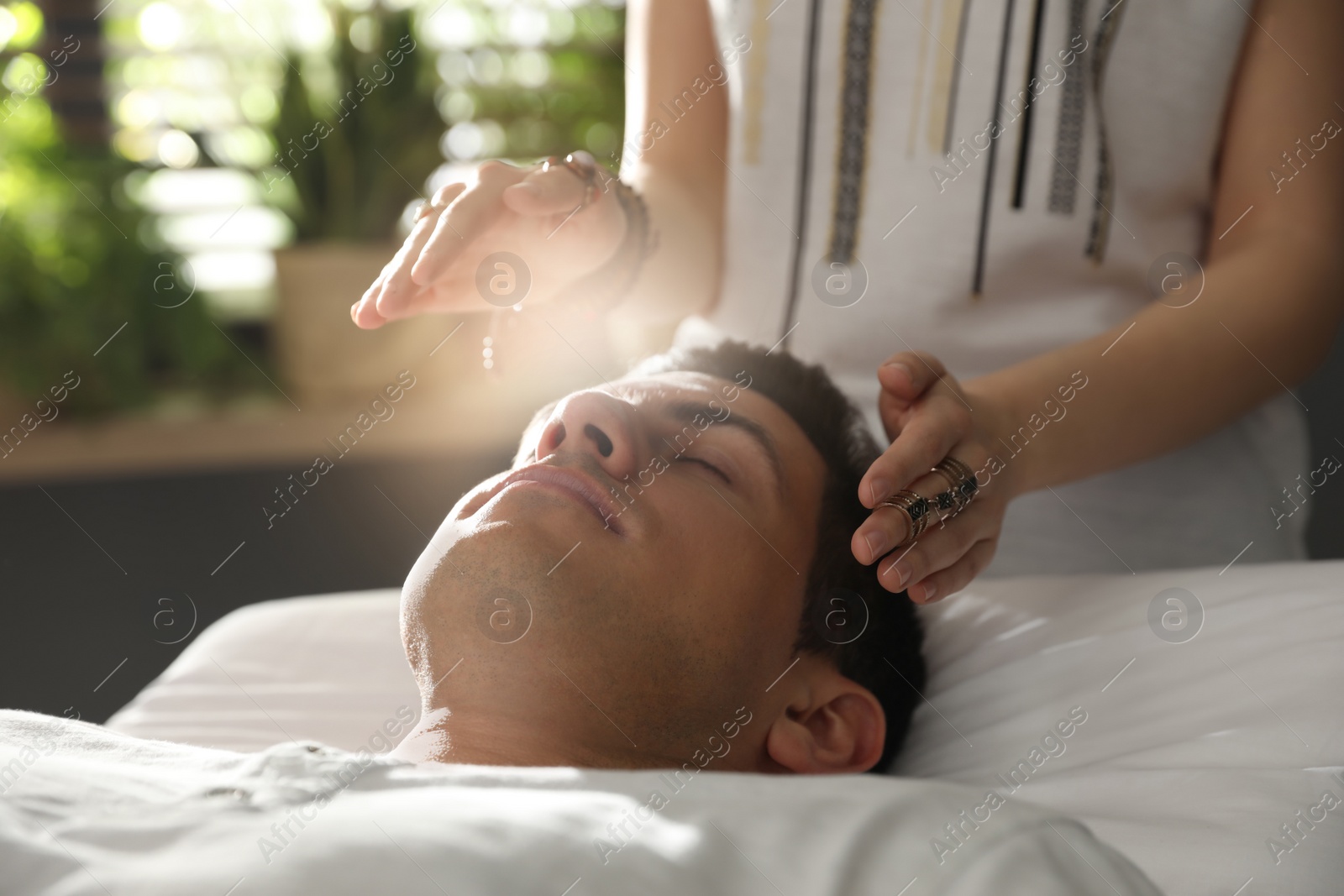 Photo of Man during healing session in therapy room