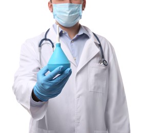 Doctor holding light blue enema on white background, closeup