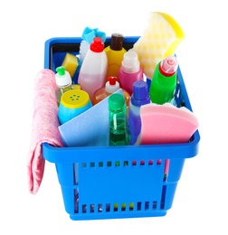 Shopping basket with different detergents and rag on white background