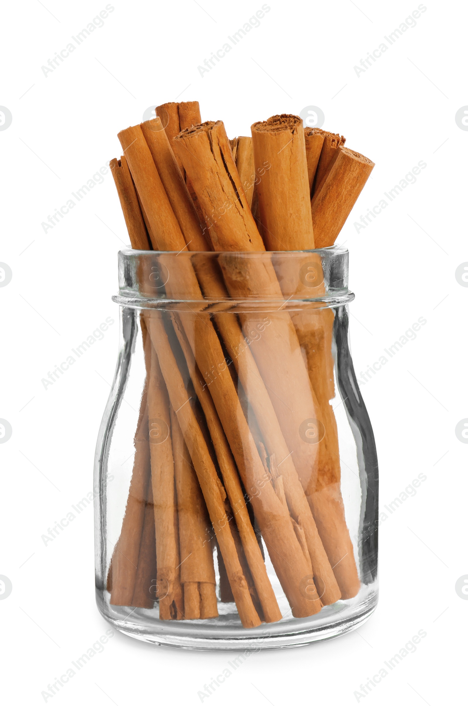 Photo of Aromatic dry cinnamon sticks in glass jar on white background