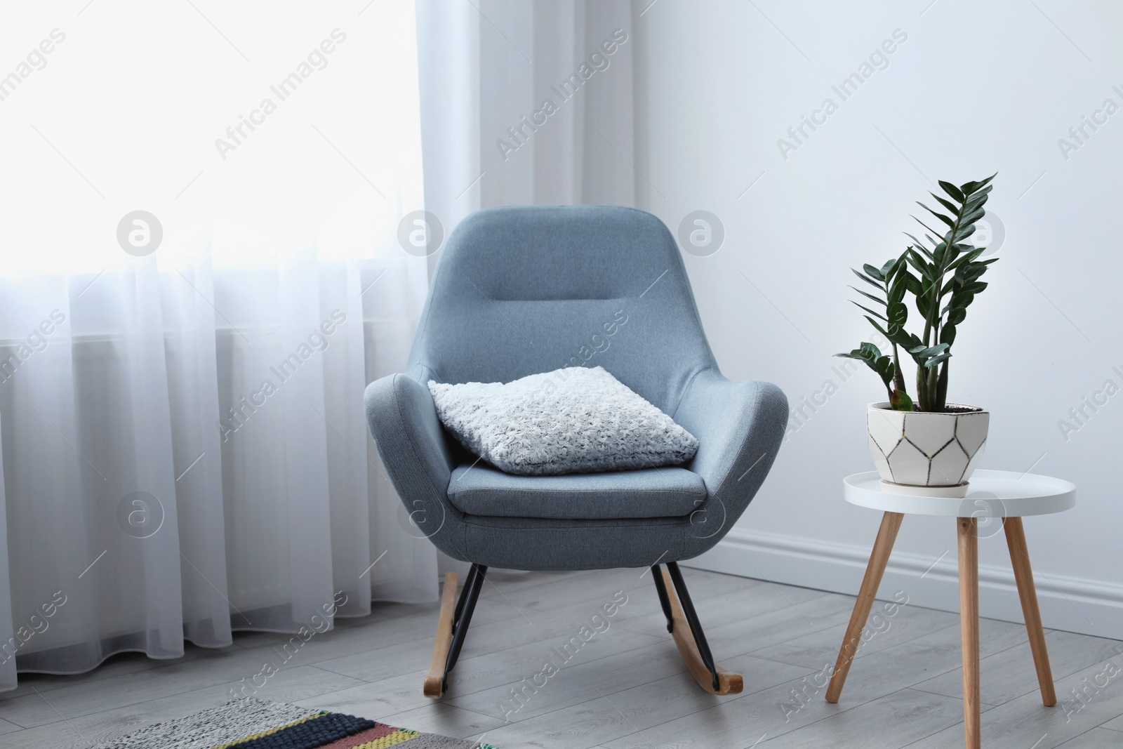 Photo of Elegant living room interior with rocking chair