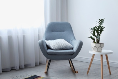 Elegant living room interior with rocking chair