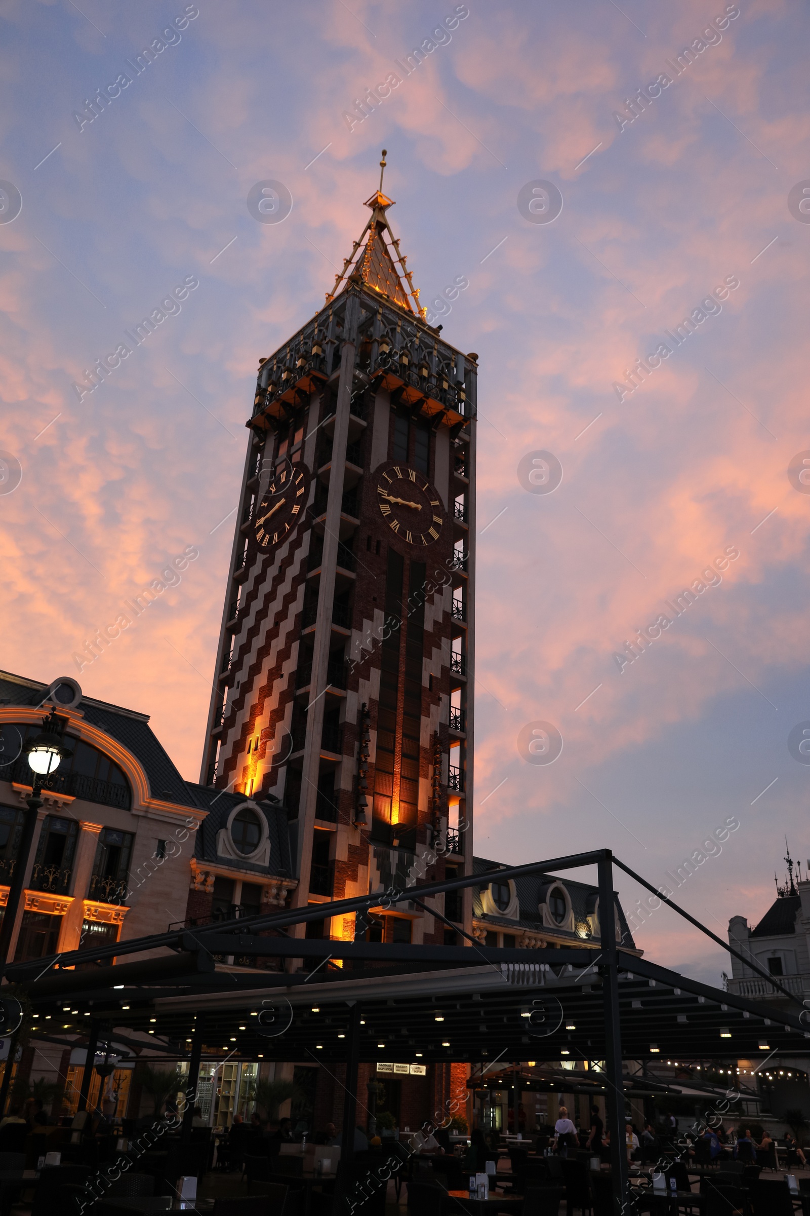 Photo of BATUMI, GEORGIA - MAY 31, 2022: Beautiful Piazza Boutique Hotel against colorful twilight sky