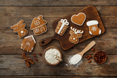 Flat lay composition with delicious homemade Christmas cookies on wooden table