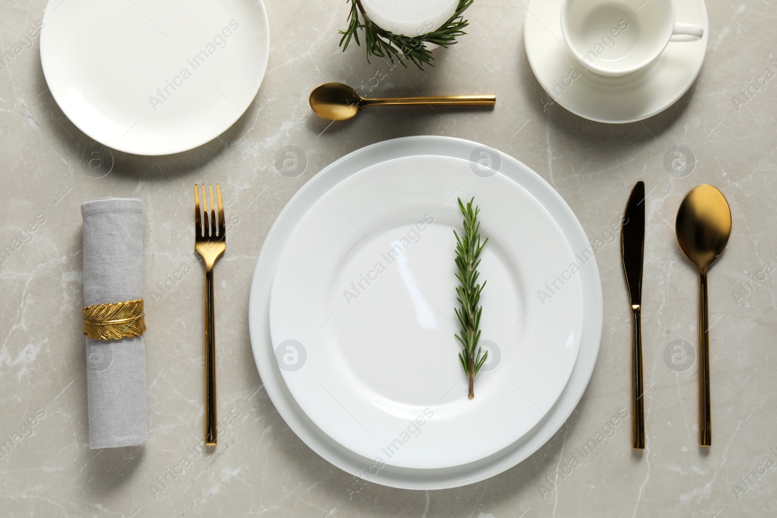 Photo of Beautiful table setting on light marble surface, flat lay