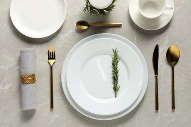 Photo of Beautiful table setting on light marble surface, flat lay