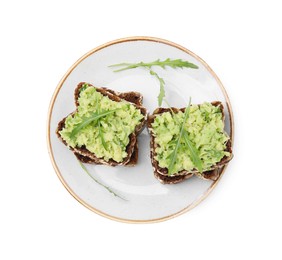 Delicious sandwiches with guacamole and arugula on white background, top view