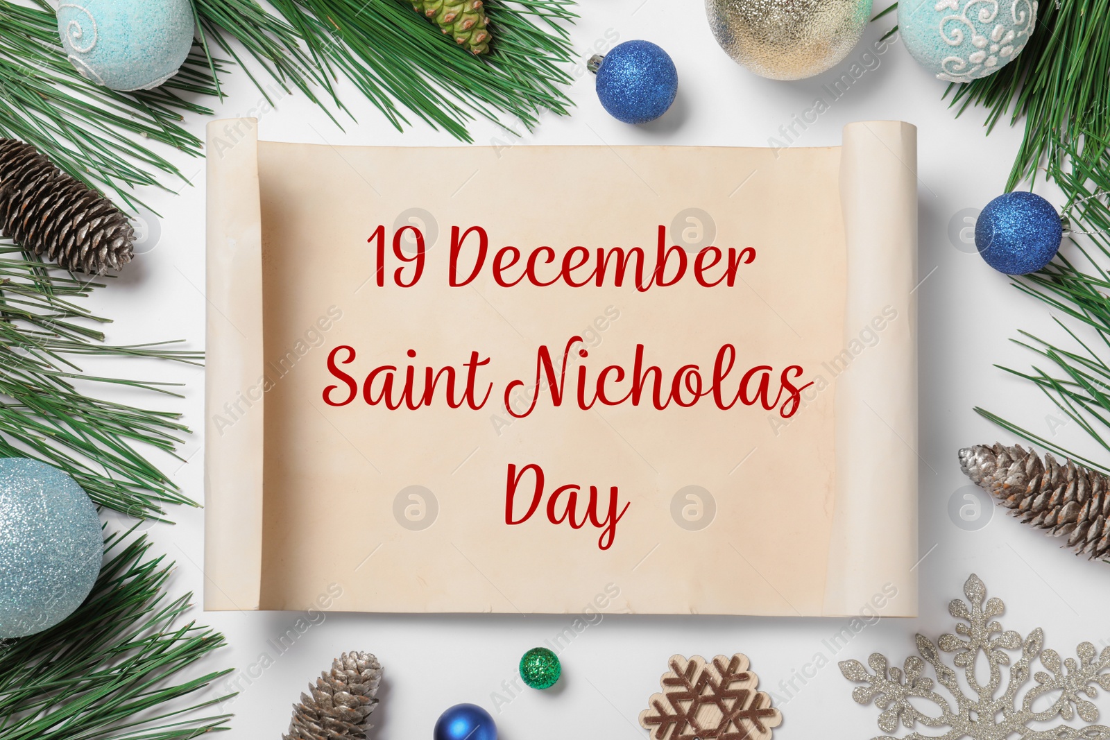 Image of 19 December Saint Nicholas Day. Christmas decor and paper on white background, flat lay