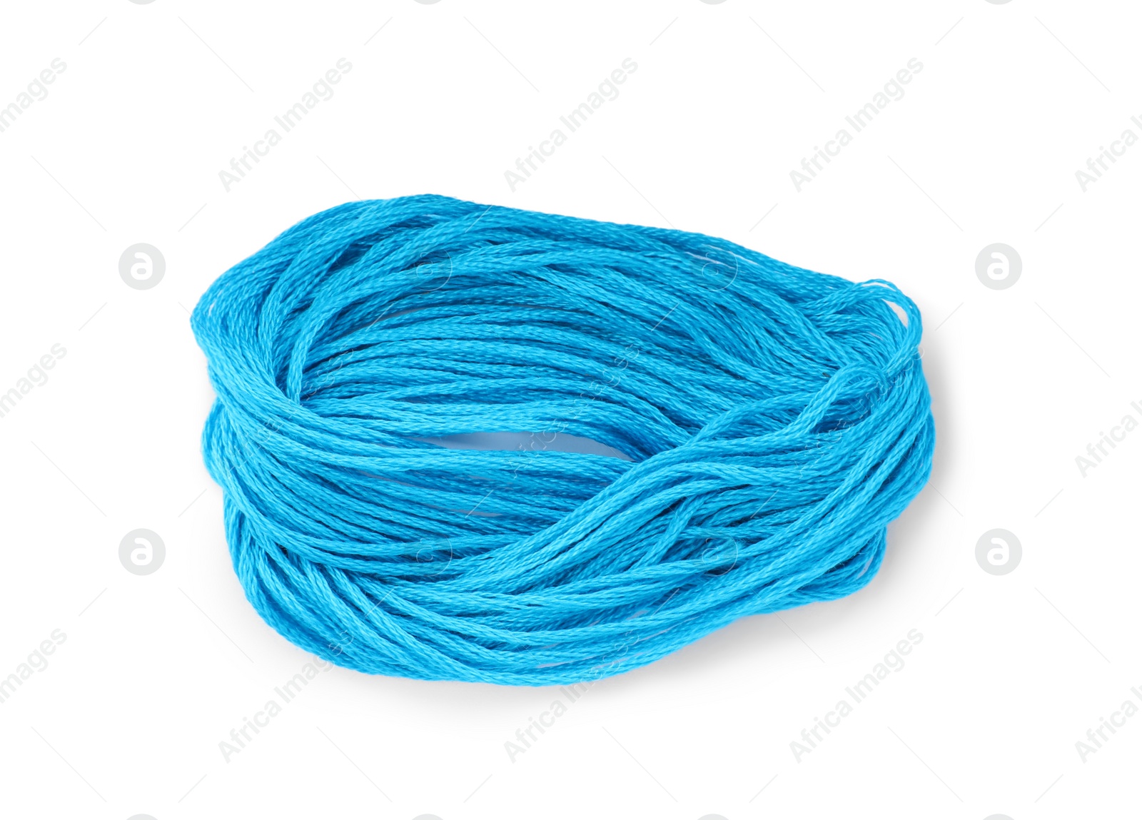 Photo of Light blue embroidery thread on white background