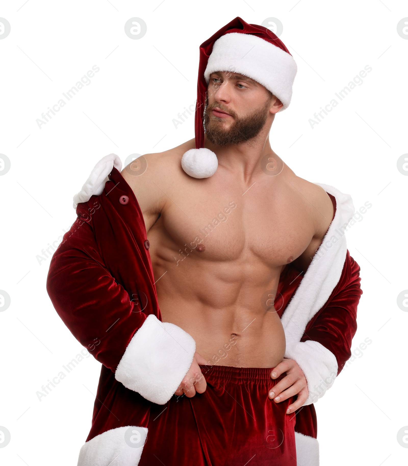 Photo of Attractive young man with muscular body in Santa costume on white background