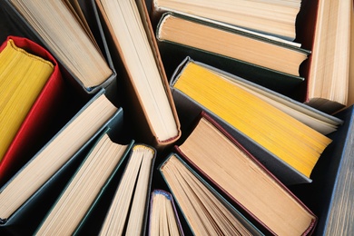 Photo of Stack of hardcover books as background, top view