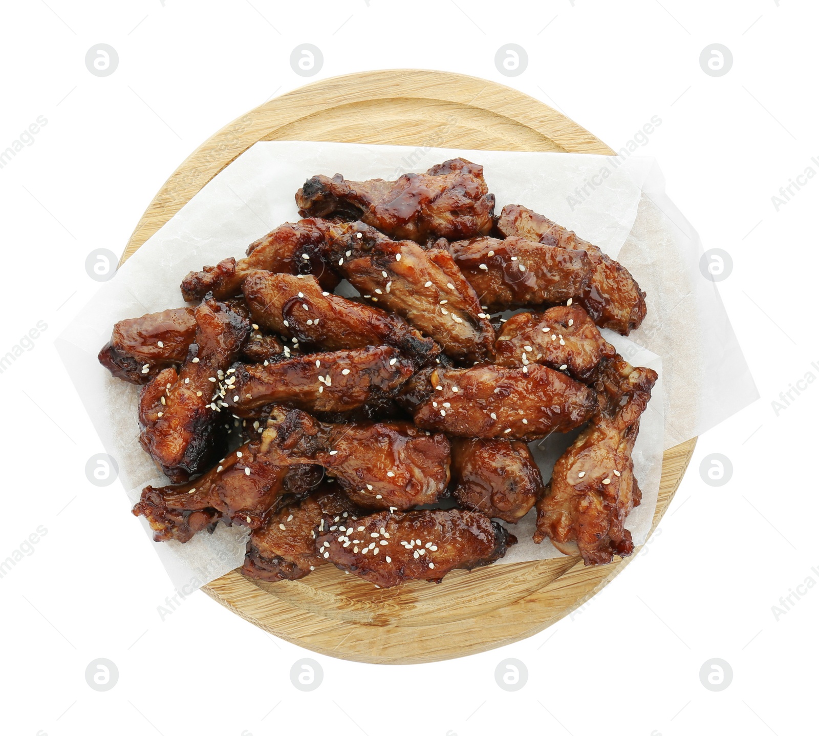 Photo of Wooden board with tasty roasted chicken wings isolated on white, top view