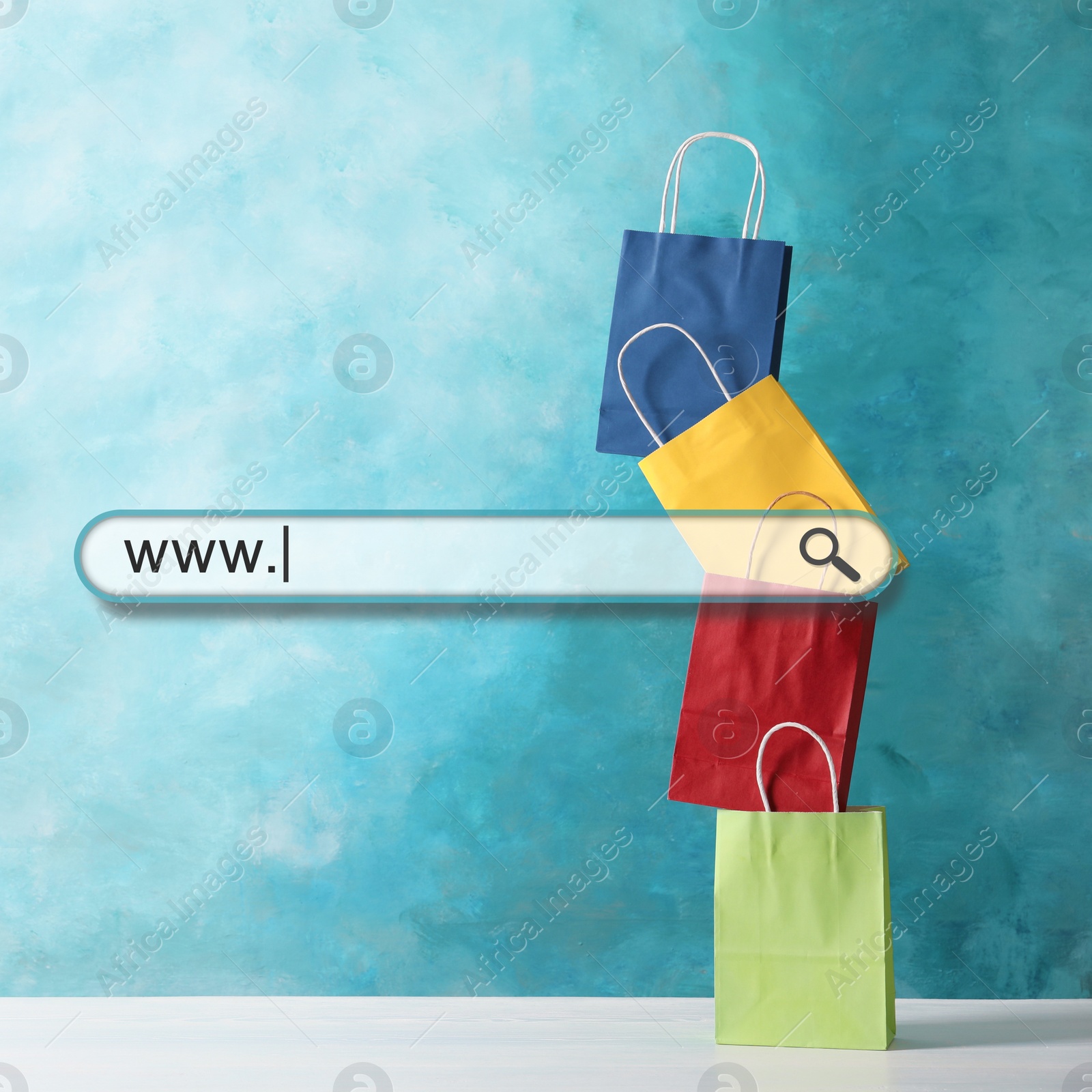 Image of Online shopping. Search bar and colorful paper bags on background