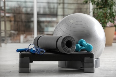 Photo of Set of fitness equipment of floor indoors