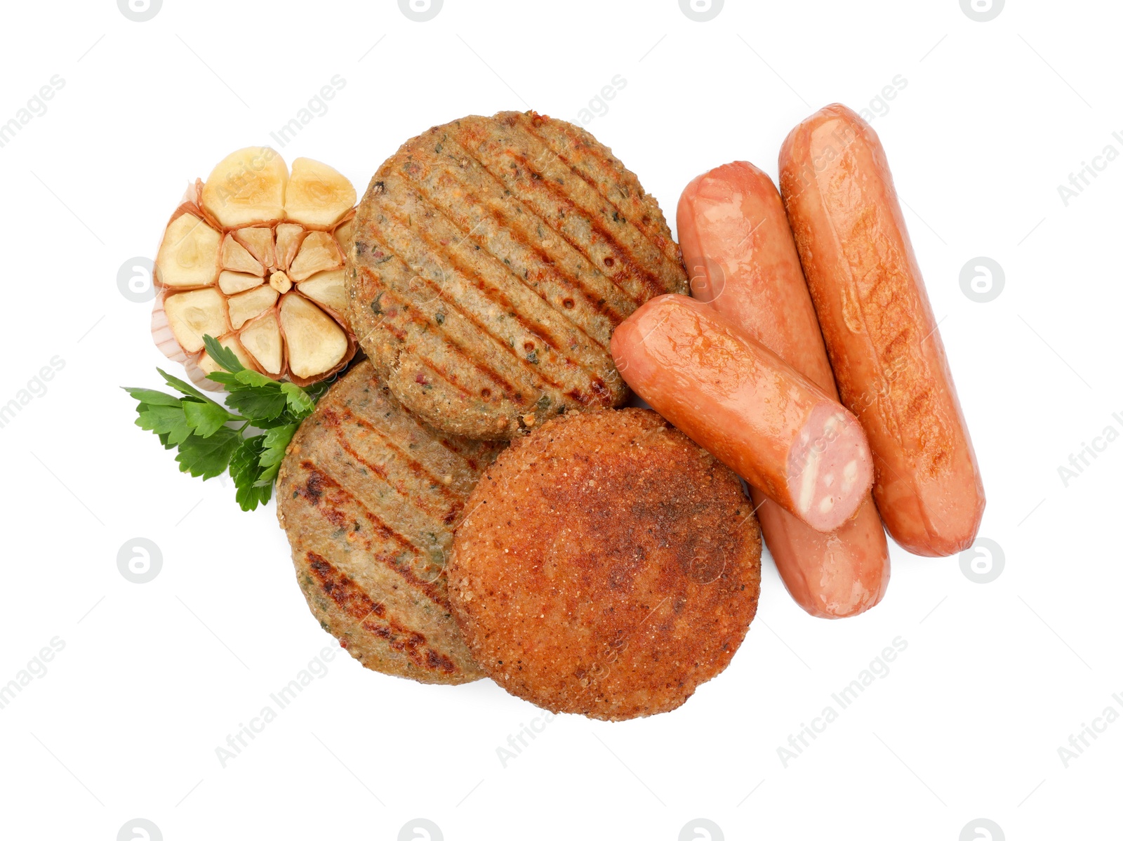 Photo of Delicious vegan cutlets, sausages and garlic isolated on white, top view