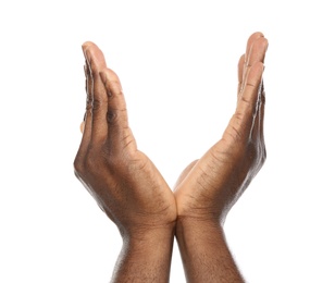 African-American man holding something in hands on white background, closeup