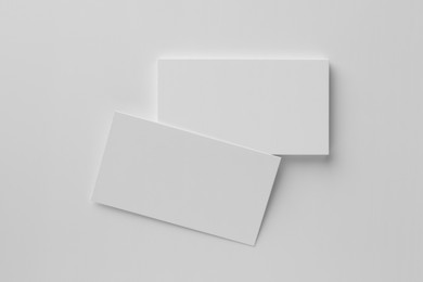 Photo of Blank business cards on white background, top view. Mockup for design