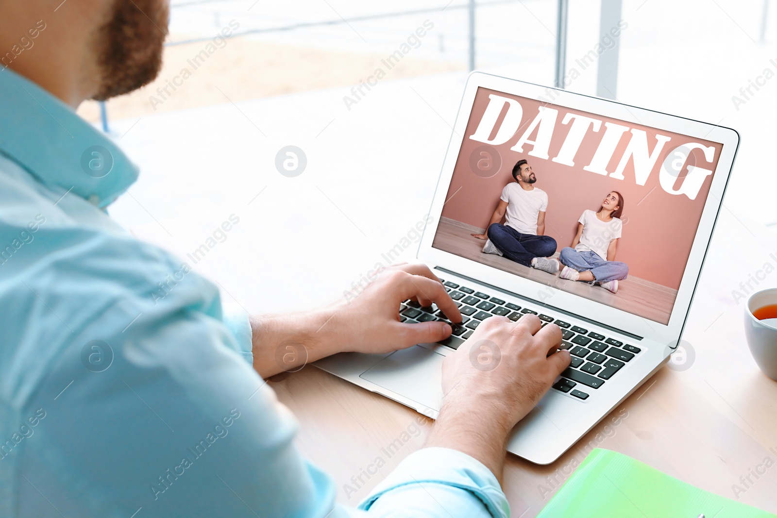 Image of Man visiting dating site via laptop indoors, closeup