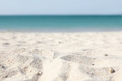 Beach with clean hot sand on sunny day, closeup. Space for text