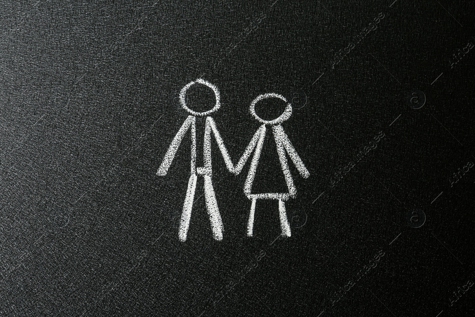 Photo of Figures of man and woman drawn on blackboard. Sex education