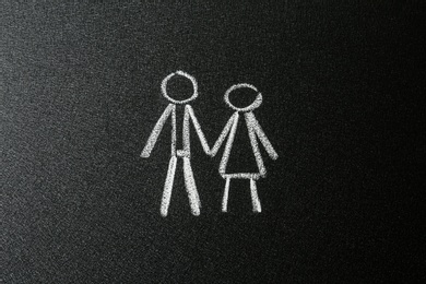 Photo of Figures of man and woman drawn on blackboard. Sex education