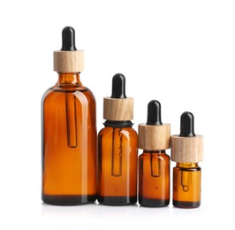 Photo of Glass bottles of tincture isolated on white