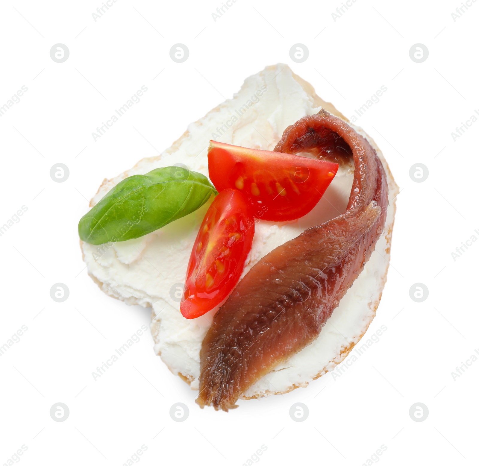 Photo of Delicious sandwich with cream cheese, anchovy, tomatoes and basil on white background, top view