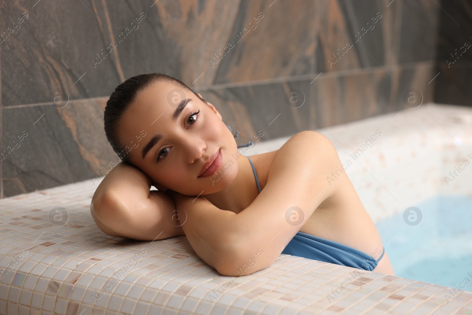 Photo of Beautiful woman relaxing in spa swimming pool