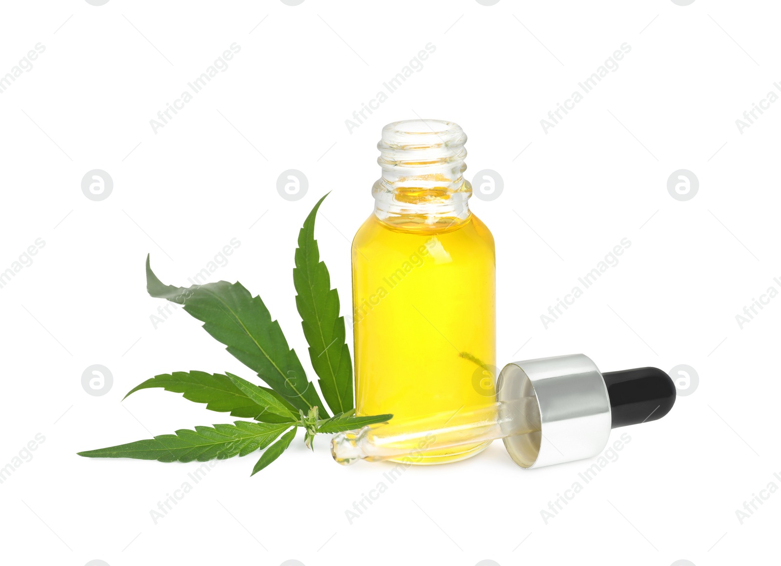 Photo of Bottle of hemp oil and leaves on white background